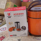 Close-up of thermos flask with lid and handle
