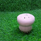Facial cleansing brush with octopus design, made from silicone for gentle exfoliation.