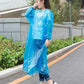 Button-up waterproof raincoat for adults, portable for travel.