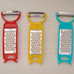 Set of kitchen tools including peeler, grater, and cutter for vegetables